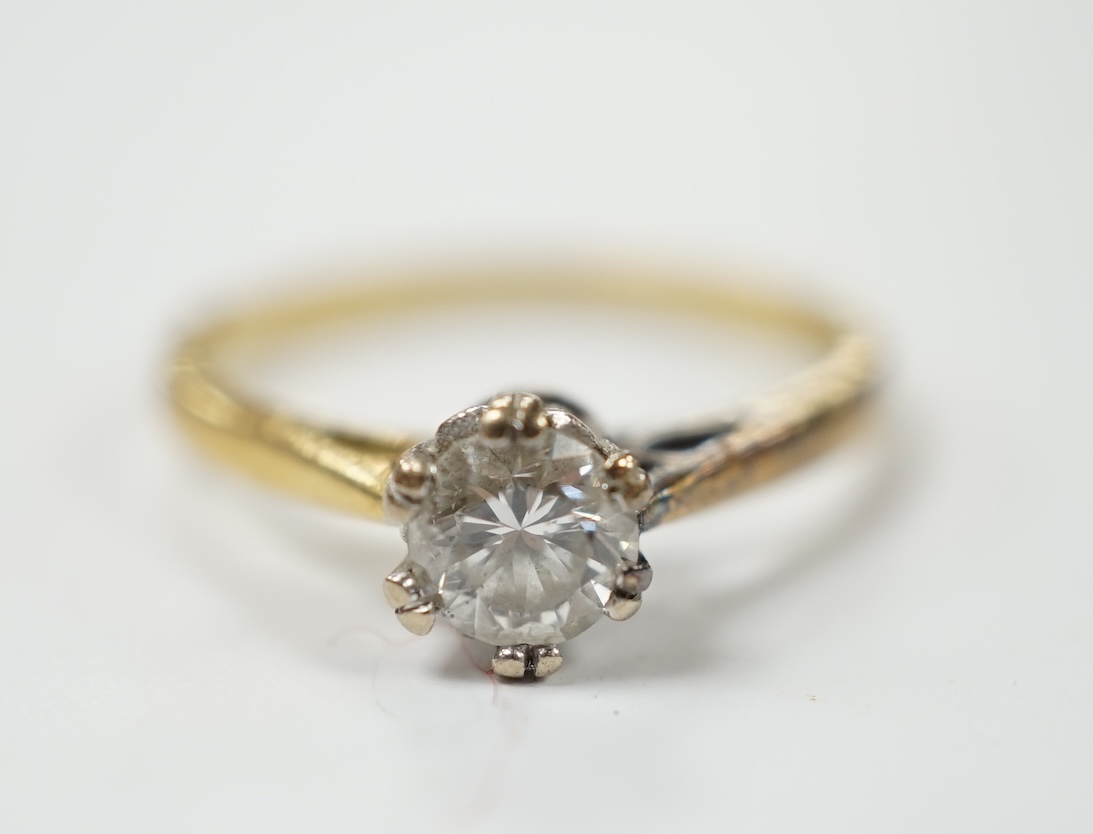 A modern 18ct gold and solitaire diamond set ring, size N, gross weight 2.8 grams. Condition - fair